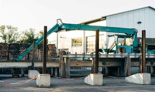 a crane working outside an office building